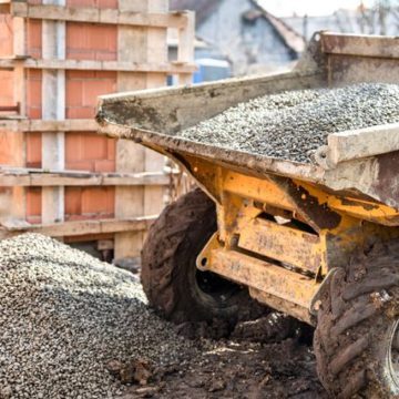 Dumper truck unloading construction gravel, sand and curshed stones Dumper truck unloading construction gravel, sand and crushed stones
